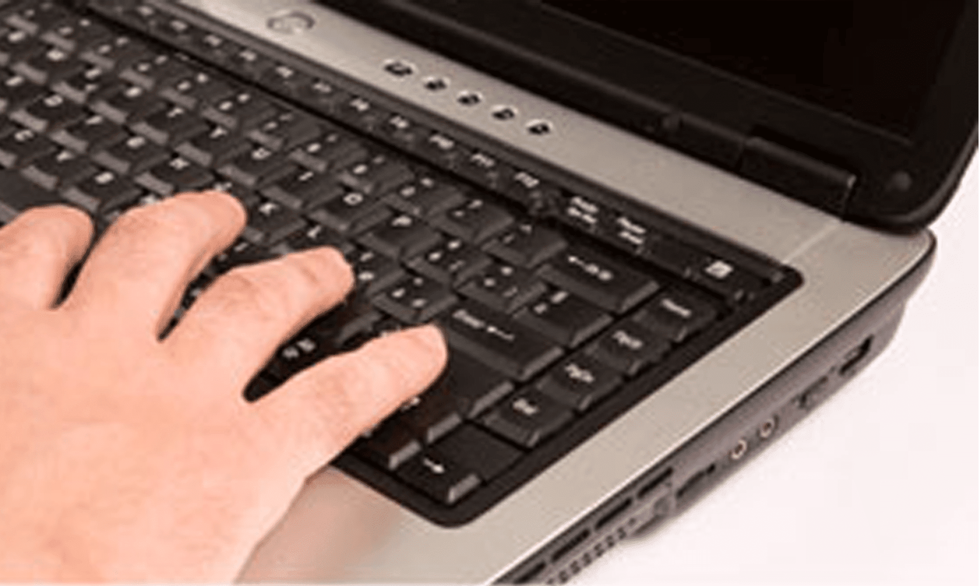 K9 report writing fingers typing on laptop