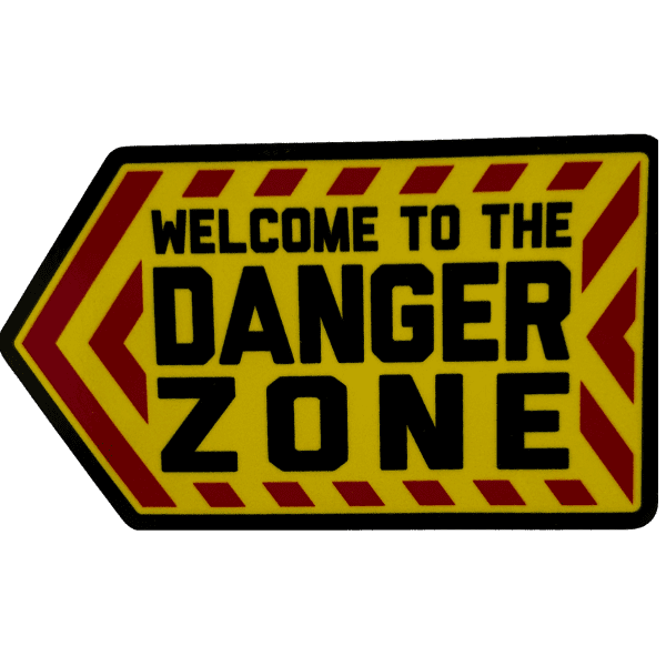 Yellow and red warning style sticker with the words "WELCOME TO THE DANGER ZONE" in bold, black font.